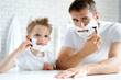 © fotofabrika - Father and his little son shaving together
