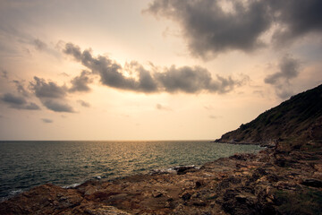 Canvas Print - Sea rocks with wave on sunset