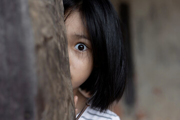 Little girl with eye sad and hopeless. Human trafficking and fear child concept.