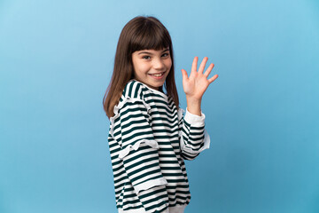 Wall Mural - Little girl over isolated background saluting with hand with happy expression