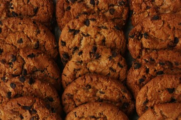 Canvas Print - Delicious oatmeal cookies with chocolate on the table