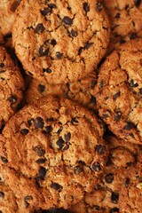 Canvas Print - Delicious oatmeal cookies with chocolate on the table