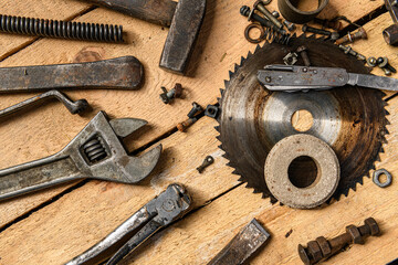 Wall Mural - Variety of old vintage household hand tools still life on a wooden background in a DIY and repair concept