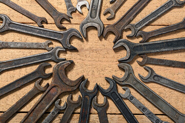 Wall Mural - old vintage hand tools - set of wrenches on a wooden background with blank space for text