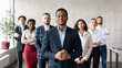 Leinwandbild Motiv Successful African Businessman Standing With His Business Team In Office
