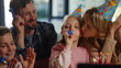 © stockbusters - Family congratulating girl virtual party. Parents kids having online party
