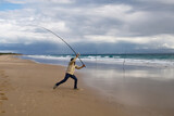 Fototapeta Boho - photograph of a fisherman on the beach