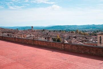 Wall Mural - Panoramic view from a patio of the medieval Italian village of Gubbio with old buildings and constructions (Umbria, Italy, Europe)