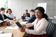 © Prostock-studio - African American Businesswoman Using Tablet On Corporate Meeting In Office