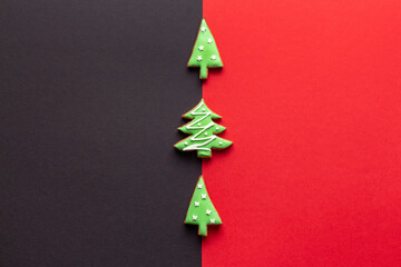 Christmas backdrop made of trendy black and red backgrounds and gingerbread between them