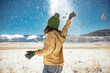© cppzone - Happy girl is tossing snow and having fun