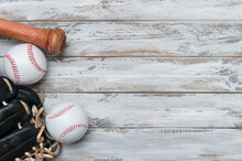 Baseball Bat, Glove And Ball On Wooden Background.  Sport Theme Background With Copy Space For Text And Advertisment