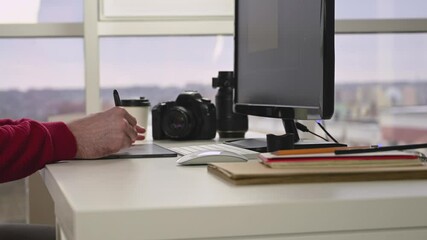 Wall Mural - designer working on project on tablet in office