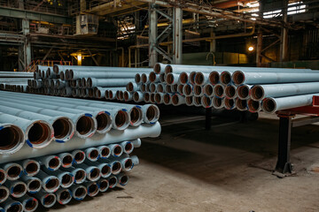 Wall Mural - New cast iron pipes for pipeline construction in warehouse