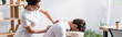 Side view of masseuse doing back massage for businessman in office, banner