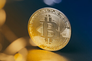 Wall Mural - Bitcoins and new virtual money. Gold coin with B.Mining icon or blockchain technology