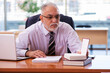 © Elnur - Old businessman employee working in the office