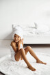 © jul14ka - Little girl wrapped in a towel relaxing in an expensive hotel room.
