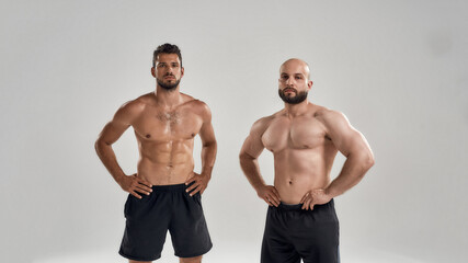Sticker - Young muscular caucasian men standing with hands on waist