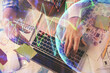 © peshkova - Double exposure of man and woman working together and forex graph hologram drawing. Financial analysis concept. Computer background. Top View.