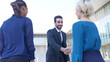 © metamorworks - Group of multi ethnic people shaking hands. Global business. Diversity.