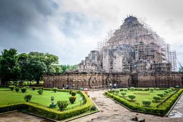 Ancient sandstone carvings on the walls of the ancient sun temple at Konark, India.
