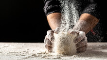 Hands Of Baker Kneading Dough Isolated On Black Background. Prepares Ecologically Natural Pastries