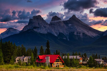 Beautiful View Of Residential Homes With Canadian Rocky Mountains In The Background. Colorful Dramatic Sunset. Taken In Canmore, Alberta, Canada.