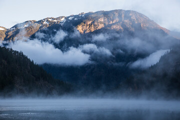 Wall Mural - a foggy morning landscape in north cascades national park in washington state.