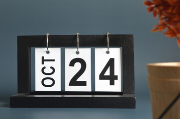 October 24, Date design with a black wooden calendar for a business, Date Plans to remind.