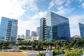 Wall Mural - Modern Corporate Buildings in City Downtown District with Sun Light