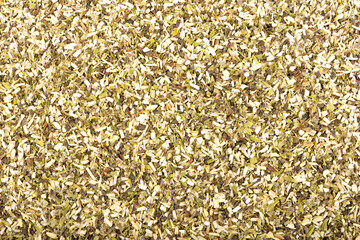 Full frame of dried chopped sage as background.