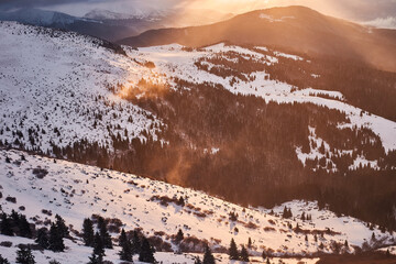 Winter sunrise landscape in snowy mountains