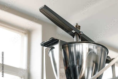 Close up of industrial metal juicer appliance