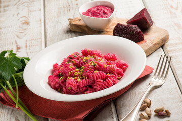 Sticker - pasta with beet pesto and pistachio nuts