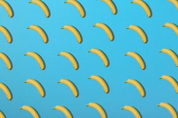  bananas pattern on blue background flat lay