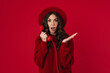 © Drobot Dean - Shocked charming brunette girl in hat talking on retro phone