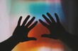 © Alp Peker - hands reaching out to silhouette illumination of colors