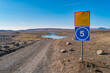 © neurobite - Sign standing at the gravel off road alerting about fording, crossing unbridged river in background, entering inhabitable Highlands in Iceland