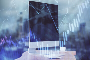 Stock market graph and table with computer background. Multi exposure. Concept of financial analysis.