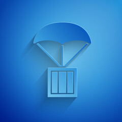 Sticker - Paper cut Airdrop box icon isolated on blue background. Paper art style. Vector.