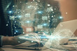 © peshkova - Envelop hologram drawing with businessman working on computer on background. Electronic mail concept. Double exposure.