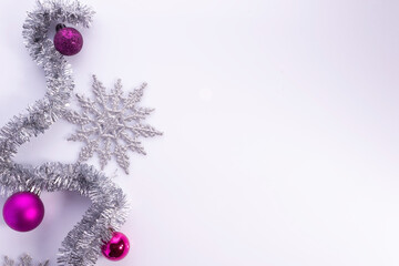 christmas flatlay with purple decorations on white background