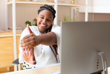 Lovely Black Business Woman Stretching Arms In Workstation. .