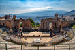 Photograph of the ancient theatre of Taormina with Mount Etna in the background