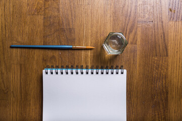 Poster - painting utensils on a wooden surface