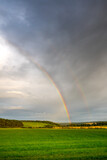 Fototapeta Tęcza - An Early Autumn Rainbow in a dramatic sky landscape