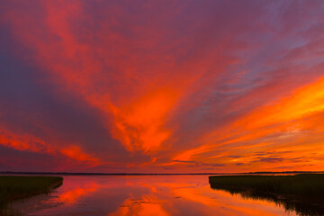 Wall Mural - Beautiful colorful sunset over the lake summer landscape.