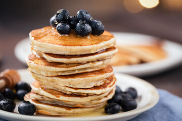 Wall Mural - Pancakes with blueberries and syrup for Christmas morning breakfast