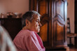 © Marcos Osorio/ADDICTIVE STOCK - Side view of a senior woman with Alzheimer's mental health issues sitting in a sofa alone in her home